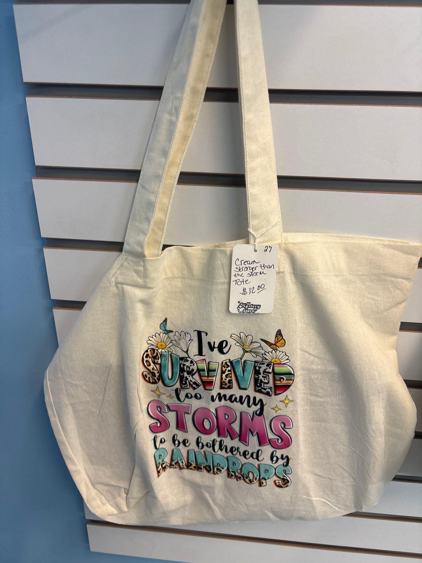 Cream color tote Stronger than the storm