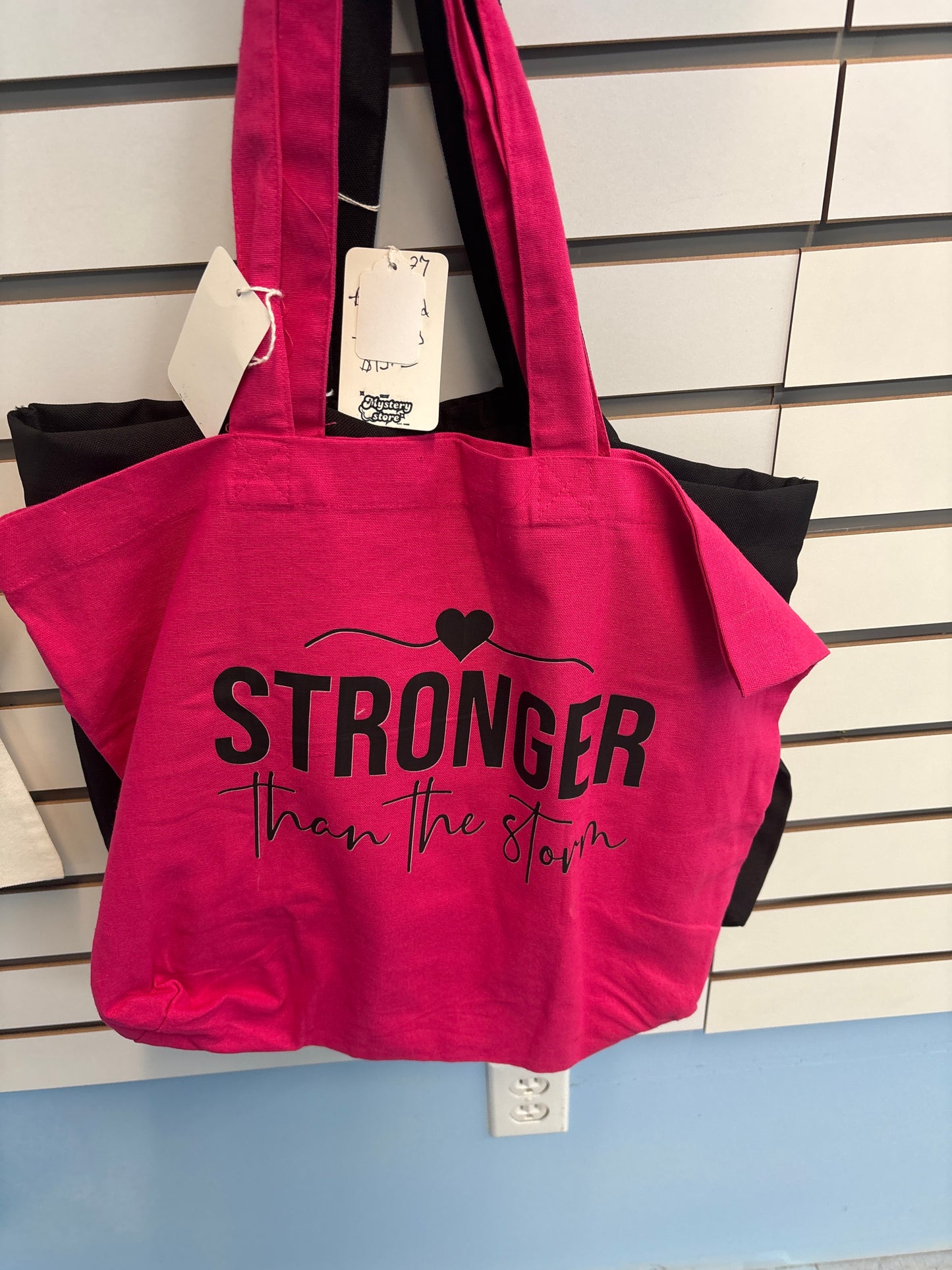 Pink Stronger than the storm tote bag