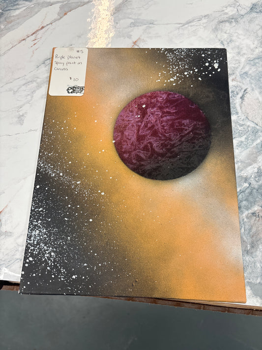 Purple planet spray painted on canvas