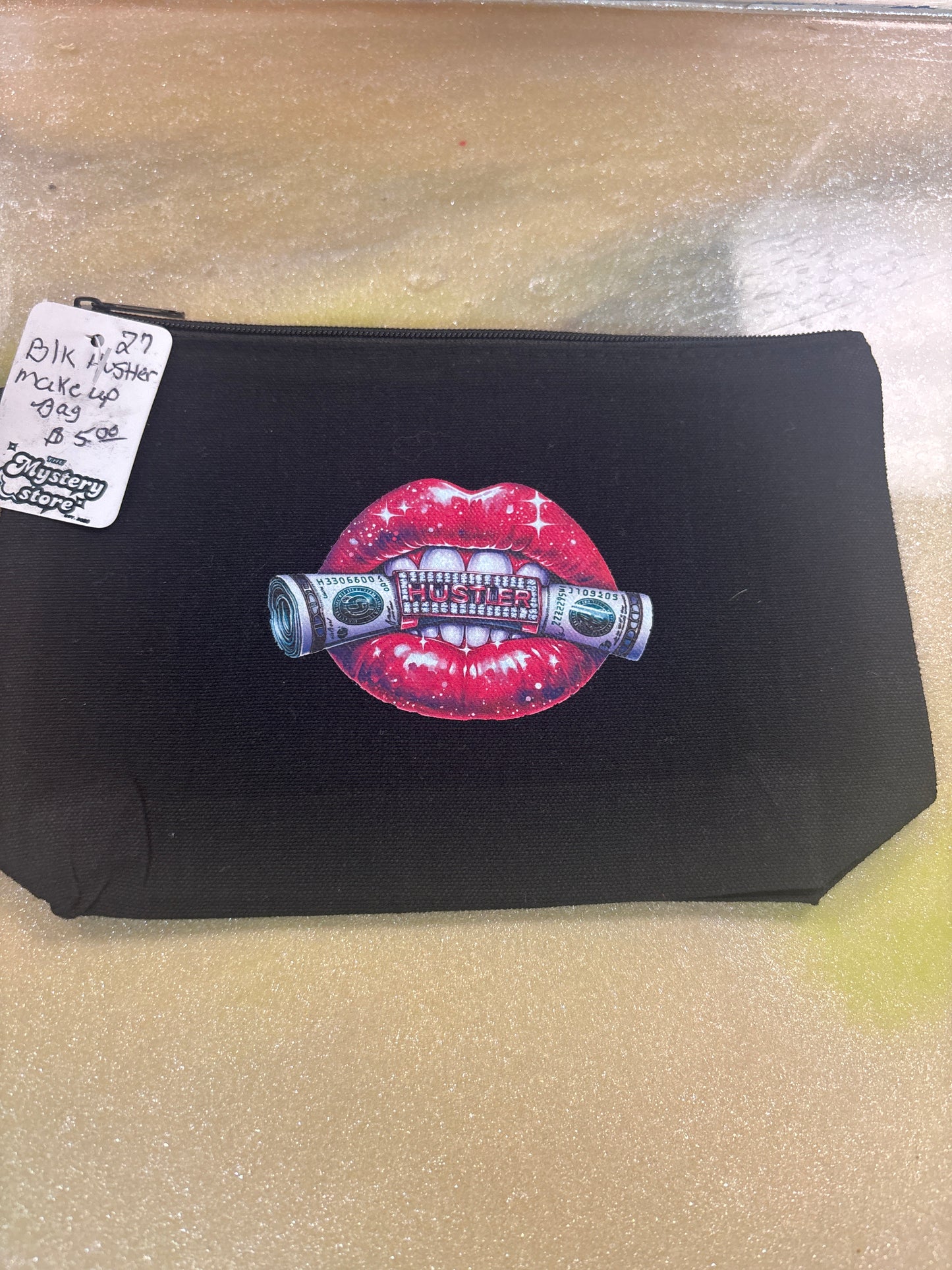 Black hustler makeup bag