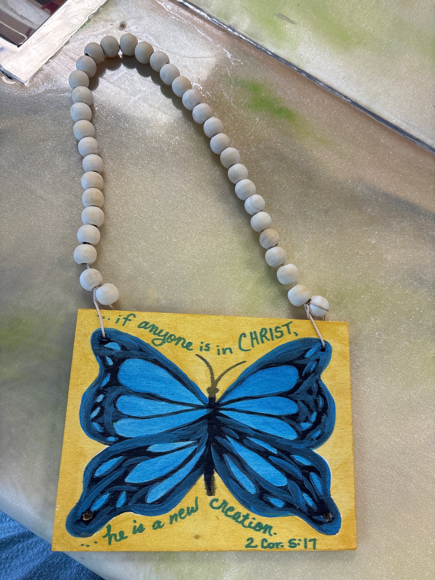Blue butterfly on wood