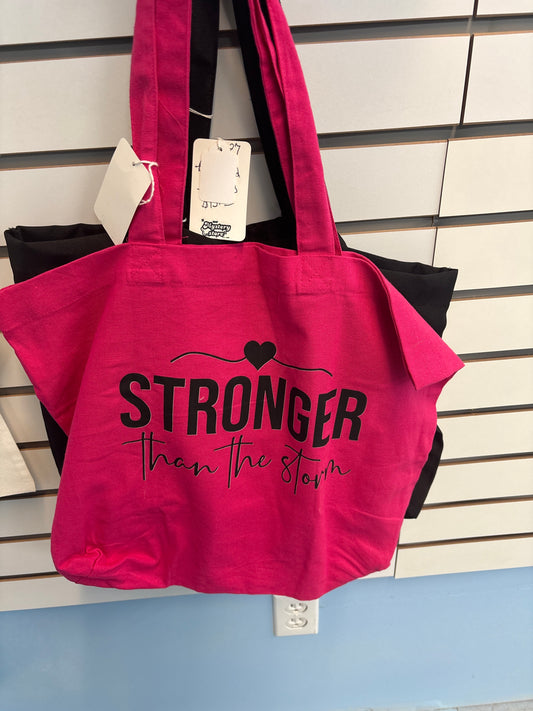 Pink Stronger than the storm tote bag