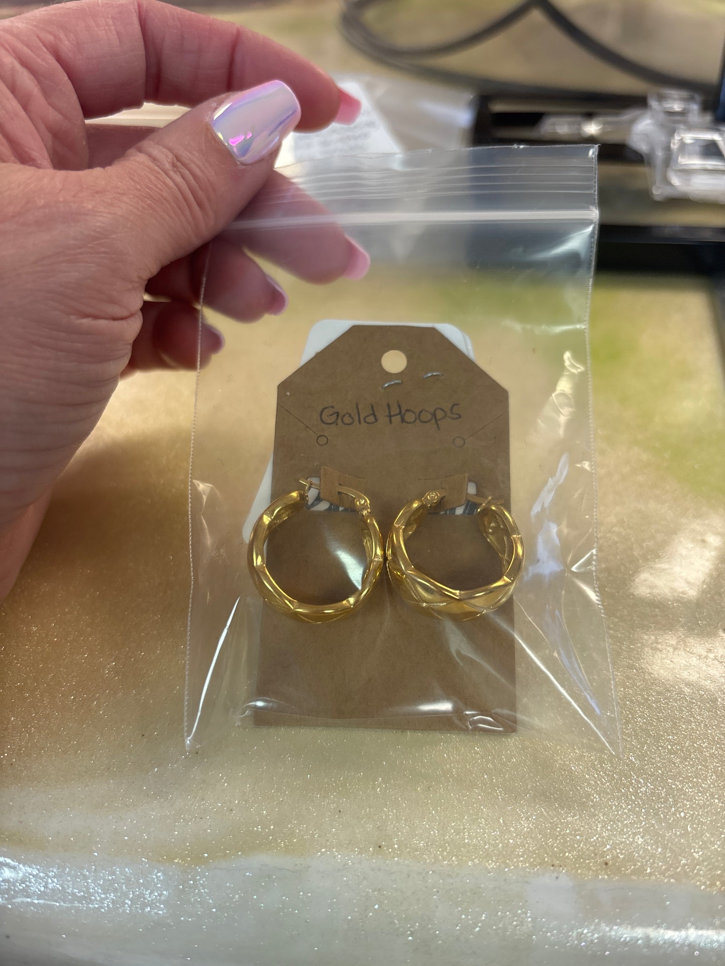Gold hoop earrings ￼